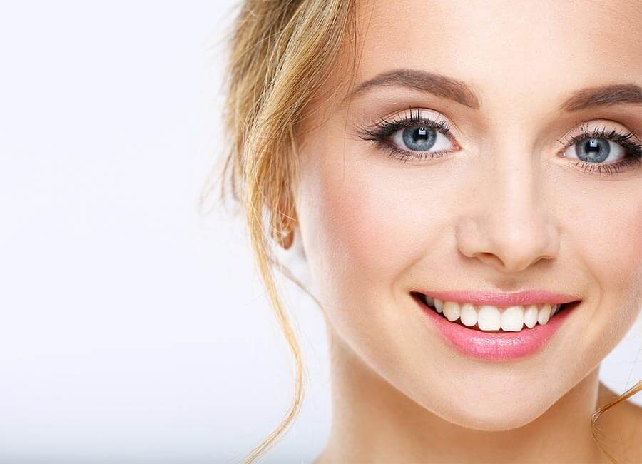 Girl Smiling after Teeth Whitening Treatment