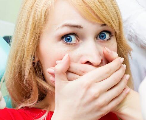 Woman Covering Mouth with hands