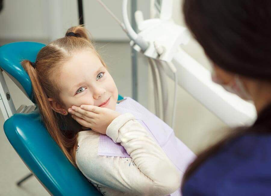 Child Smiling in Dentist Chair haslemere geotagged